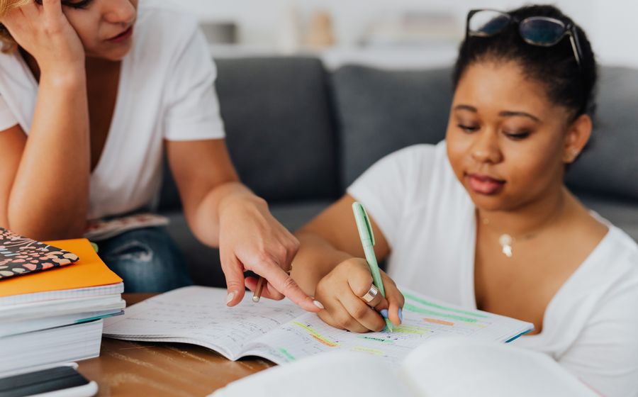 A tutor working through a task with a student