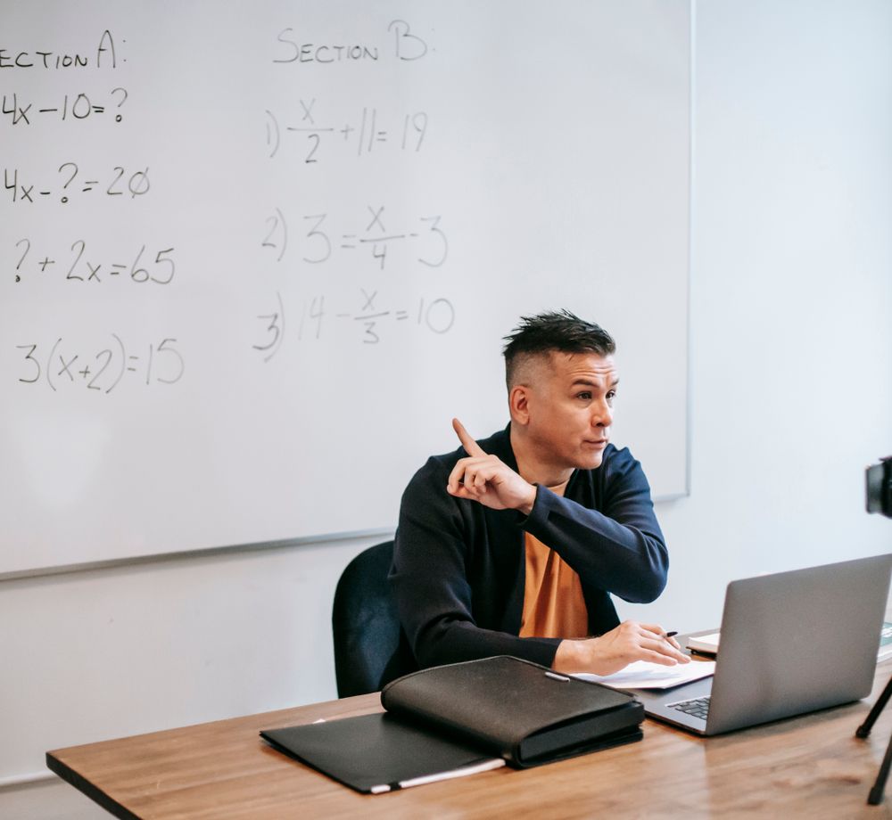 A tutor teaching an online lesson with a whiteboard